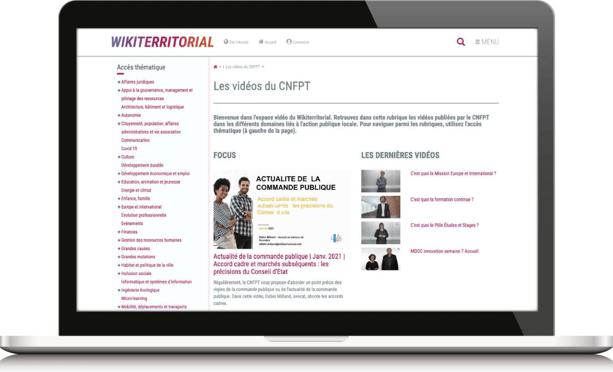 A silver laptop displays a French website titled "Les vidéos du CNFPT" with video thumbnails.